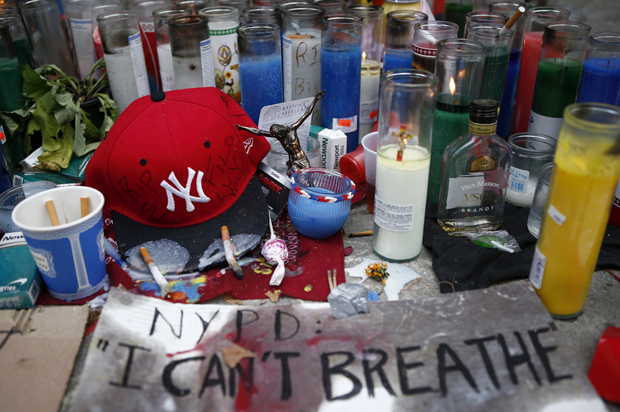 Candles are seen at the memorial of Eric Garner in Staten Island, New York, July 21, 2014. 