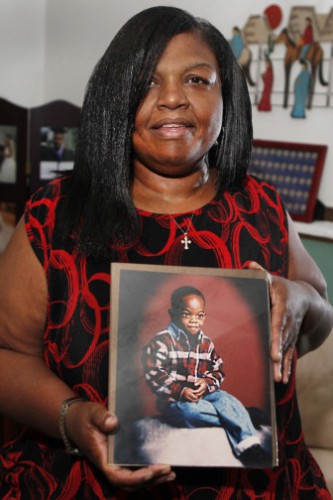 Sharletta Evans holds a photograph of her 3-year-old son Casson in Aurora, Colo., last July. Casson was killed in a drive-by shooting by two 15-year-olds. 