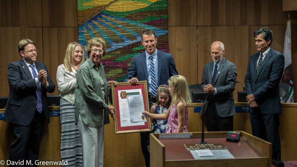 Senator Lois Wolk presents a proclamation to Dan Wolk with his daughters presenting their own