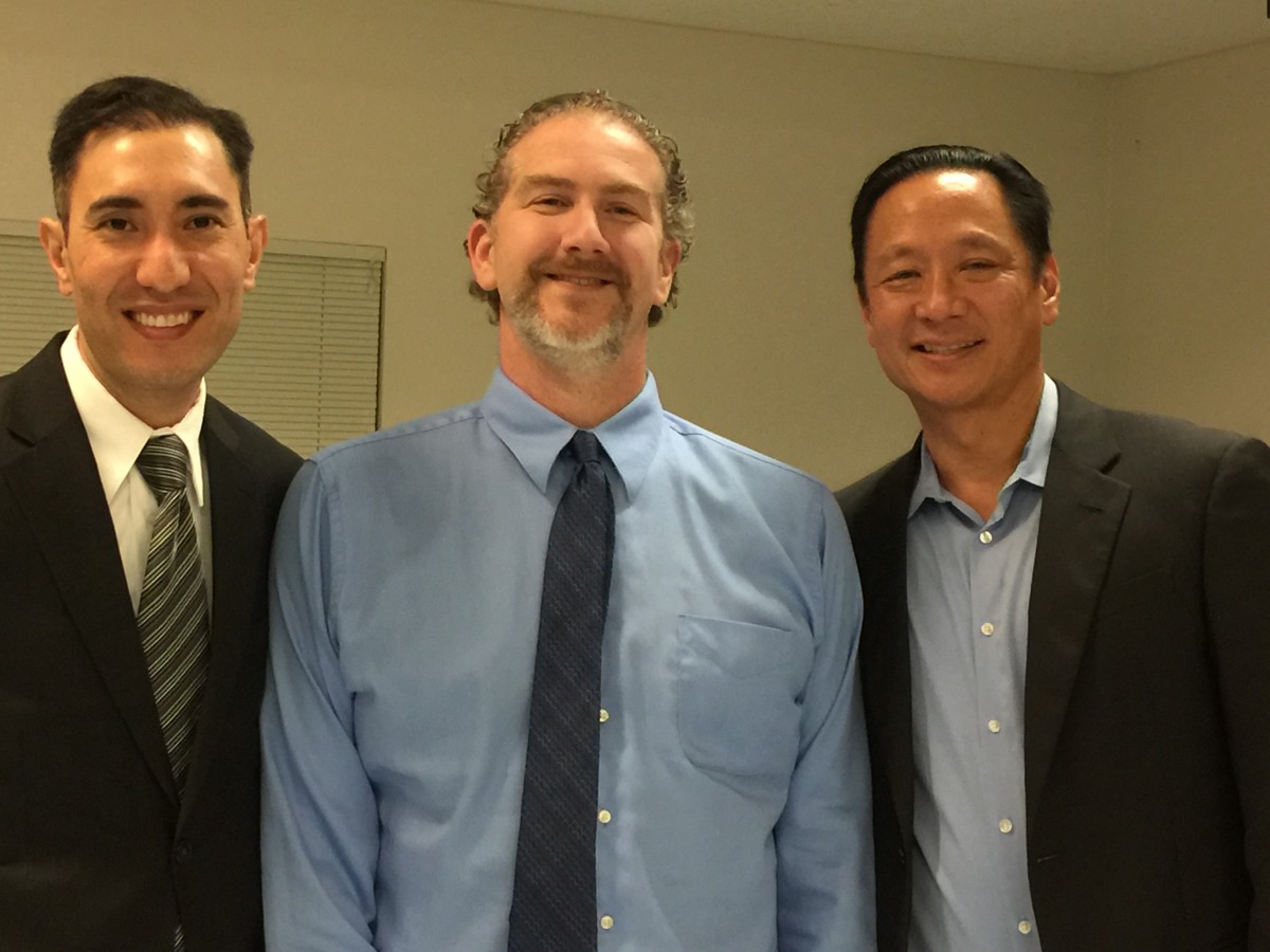 Jeff Adachi (right) poses next to Phil Telfeyan (left) and Vanguard Director David Greenwald (center)