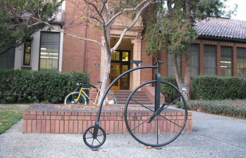 Davis City Hall with an old style bicycle statue out front