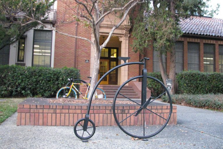 Davis City Hall with an old style bicycle statue out front