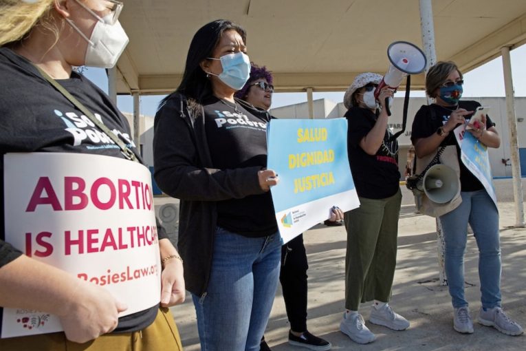 Protesters stand outside the Starr County Jail after Lizelle Herrera, 26, was charged with murder for allegedly performing what authorities called a "self-induced abortion," in Rio Grande City, Tex., April 9. (Jason Garza/Reuters)